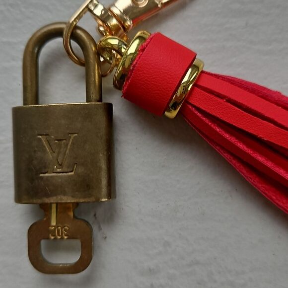 LOUIS VUITTON Red Tassel Keychain with Gold Accents - Picture 4 of 4